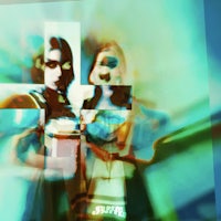 a blurry image of two people standing next to each other