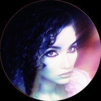 a photo of a woman with curly hair in a circle
